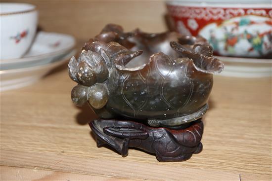 A Chinese porcelain bowl, decorated with figures in reserves on an iron red ground and two other items,